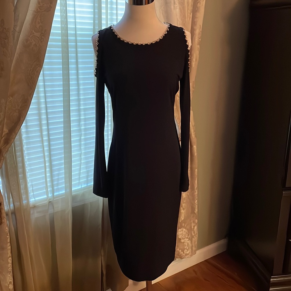 Calvin Klein black cold shoulder dress with gold color and sleeves. Size 12